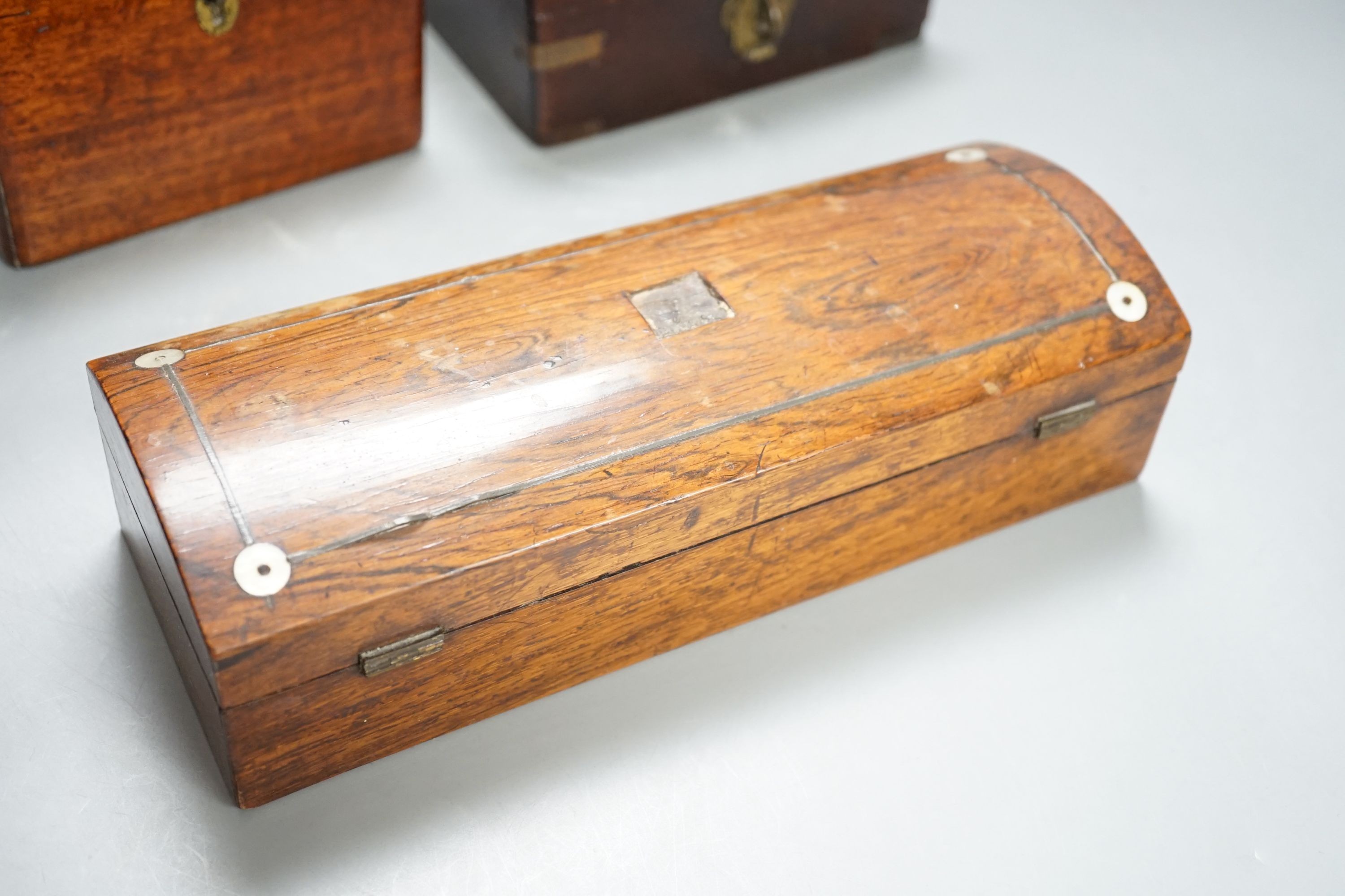 A Victorian mahogany medicine case, with bottles, 13cm. wide, a brass-mounted box and a rosewood veneered pen box